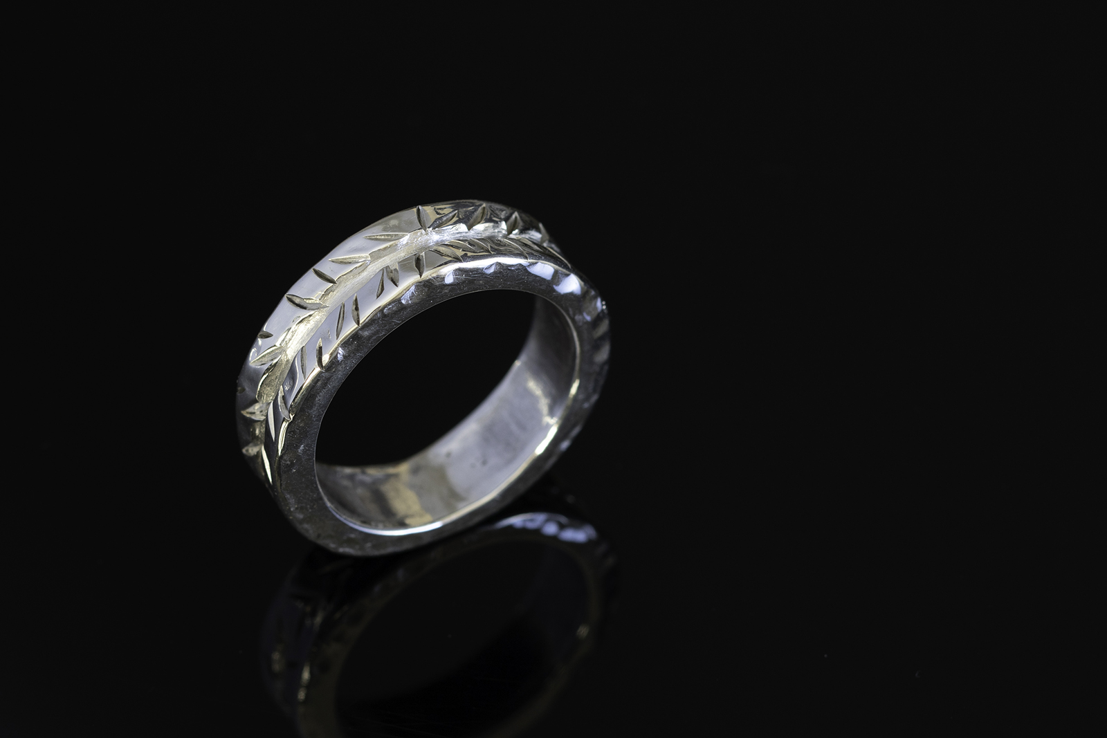 Ring on black tabletop.