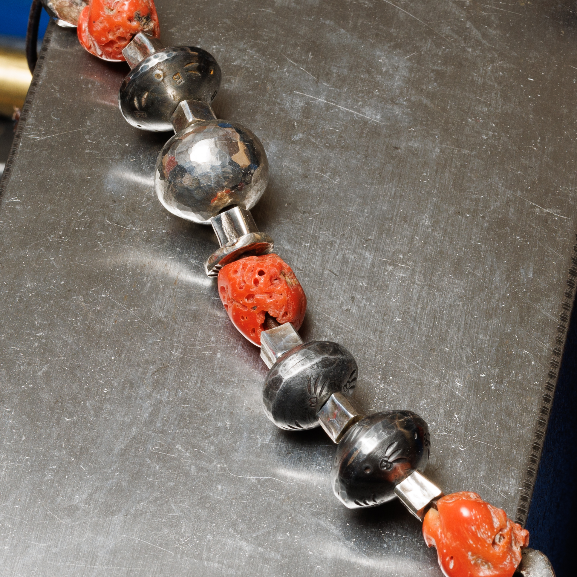 Mixed bag of beads on anvil face.